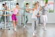 © JackF - Girls and boys are learning various dance and ballet movements in the studio