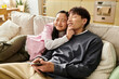 © LIGHTFIELD STUDIOS - Cozy afternoon cuddles between a young couple in their modern living space