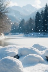Wall Mural - snowy riverbank with mountains in background.