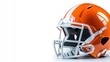 © Freshpixel - This vibrant orange football helmet stands out against a clean white background, emphasizing the importance of protection, team spirit, and style in the world of football.