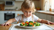© Aleksandra - Refusal to eat. The child pushes away a plate of vegetables, wrinkling his face. The child is picky about food. Children and vegetables.