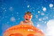 © Sunny studio - Happy child playing in waterpark. Kid having fun on summer vacation