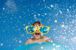 © Sunny studio - Happy child playing in waterpark. Kid having fun on summer vacation