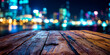 © PhotoArtHub - Dark brown wooden table surface against a blurred backdrop of colorful city lights at night, showcasing a product display or presentation area, ideal for advertisement