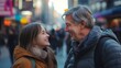 © Aura Visuals - Father and teenage daughter share joyful moment in busy city