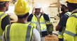 © peopleimages.com - People, meeting and manager on site of construction planning with building, maintenance or repair. Person, explain and engineering industry with foreman of property development, renovation or process