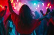 © Seema - People Dancing at a Music Festival with Colorful Lights.