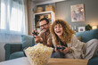 © Miljan Živković - couple man and woman husband wife play console video games at home