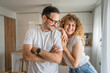 © Miljan Živković - Happy adult caucasian couple at home husband and wife family concept