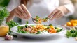 © SatoruArt - Woman eats a healthy salad with grains, veggies, greens, and creamy dressing at a bright table
