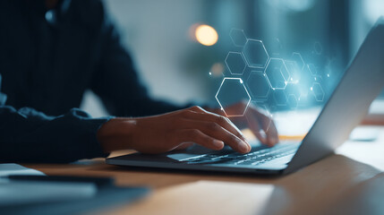 person typing on a laptop with digital hexagon overlay in a blurred office environment at night