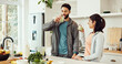 © peopleimages.com - Drinking, health and couple with smoothie in kitchen at home for wellness, diet and nutrition snack. Love, happy and man with woman enjoying green juice for vitamins or hydration breakfast in house.