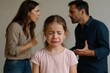 © Darya - In a domestic setting, a young girl appears distressed while her parents argue in the background. Their heated discussion reveals family discord, impacting the child's emotions