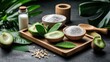 © DSimage - Fresh avocados and salt among various ingredients on a wooden cutting board ready for preparation.