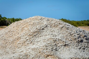 Wall Mural - Crushed seashell mound with blue sky