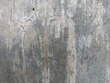 © kodhibanks - Grunge Cement Wall Texture Background. Rough grungy cement wall with natural stains and scratches. Ideal for use in industrial or abstract design backgrounds