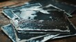 © singgih - Stack of Black and White Wet Prints Resting on a Wooden Surface
