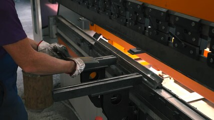 Fototapete - Sheet metal bending process in action at a manufacturing workshop