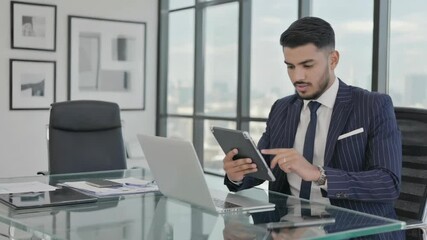 Wall Mural - businessman using cell phone at his desk.