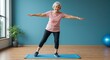© Yury - Senior woman practicing balance exercises on yoga mat in bright indoor studio, smiling and engaged in fitness activity