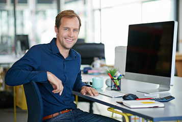 Leinwandbilder - Man, desk and computer in portrait with smile in office with designer for creative project. Businessman, table and workstation with technology for web design with graphic for website with confidence