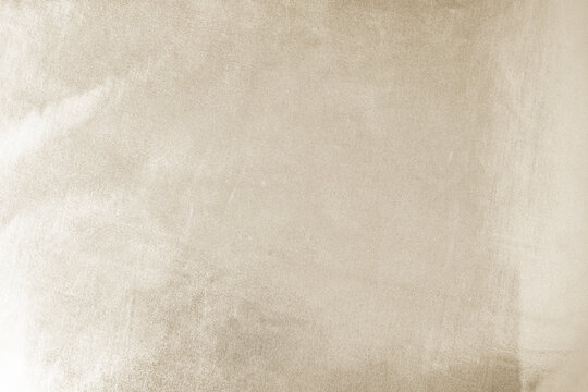 Light soft pale pastel brown beige nude white abstract background. Shiny silk fabric. Metallic shine. Light reflection. Disign.