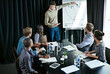 © peopleimages.com - Man, presentation and colleagues in boardroom for meeting, business planning and white board demonstration. Presenter, company and goal or idea and strategy, collaboration or professional for project