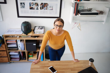 Leinwandbilder - Office, desktop and above woman with project in creative workplace with confidence and commitment. Person, portrait and hard work in company as manager of administration or planning productivity