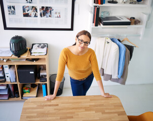 Leinwandbilder - Office, portrait and woman at desk with project in fashion, creative workplace and confident designer. Happy, person and start hard work task, productivity and employee in retail, startup or company