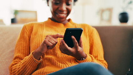Fototapete - Hands, phone and texting on sofa in home, contact or relax with scroll on web chat in living room. Black woman, smartphone and click on mobile app for notification, happy or social network in house