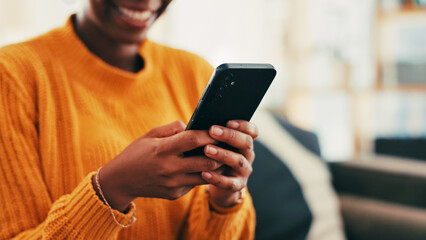 Fototapete - Hands, smile and person with smartphone, texting and online dating with app in living room or relax. Home, typing and woman with mobile for communication, connection and happy for chat in lounge