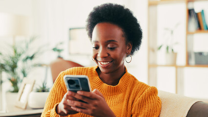 Fototapete - Browsing, smile and woman with smartphone, relax and chatting with tech in living room or social media. Home, happy and black person with mobile for communication, internet and texting in lounge