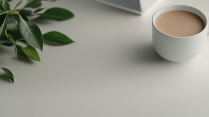 Poster - A serene workspace with a white desk bathed in soft natural light, a small plant, a ceramic coffee cup, and organized stationery for creativity