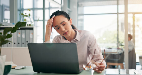 Fototapete - Woman, headache and stress with laptop at office for glitch, error and lost profit with burnout at finance agency. Person, accountant and frustrated with migraine, pain and brain fog with glasses
