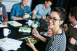 © peopleimages.com - Meeting, smile and portrait of woman with salad in office for team building lunch for collaboration. Creative, happy and Asian female designer with colleagues eating healthy meal in workplace.