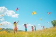 © paulsplading - A group of children joyfully flying colorful kites in an open field under a clear blue sky.