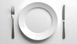 © Teeranan - Empty Plate with Fork and Knife