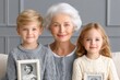 © Thammarong - A grandmother showing childhood pictures to grandchildren with emotional smiles
