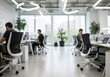 © Laki - Blurred view of people working at desks in a modern office with large windows and bright lighting