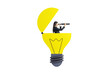 © Who is Danny - Woman in business suit looking through telescope inside cutout yellow lightbulb on clean white background, concept of vision, ideas and innovation