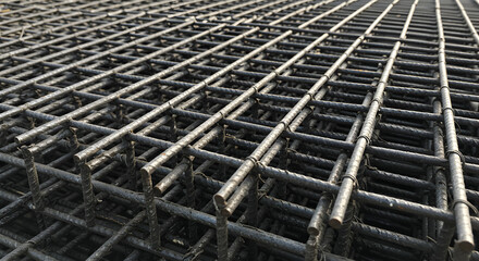 Close Up of Stacked Reinforcing Steel Bar Grids for Construction in Neutral Tones