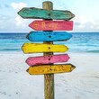 © jogeromonstero - Colorful wooden directional signs on a tropical beach (1)