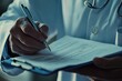 © HrdiGn Std - Doctor filling out medical form