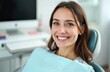 © miss irine - Smiling woman at dentist office during check-up. Happy female patient shows perfect white teeth, smiles during routine exam. Healthy oral hygiene care in clinic. Dental healthcare treatment.