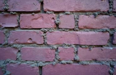 Poster - Old purple brick wall texture background. Aged, weathered surface with rough, uneven details. Vintage construction, grunge aesthetic, weathered brickwork, dirty, cracked. Ideal for creating vintage,