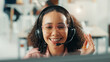 © peopleimages.com - Headset, happy and woman receptionist in office with online appointment setting, schedule or support. Audio tech, consultation and female virtual assistant with call for crm integration in workplace.