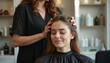 © miss irine - Young woman in salon getting pro hairstyling treatment. Smiling client with closed eyes enjoying care of beautician. Hairdresser does styling in beauty shop. Hair care, beauty and fashion.