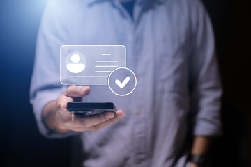 human hand holding digital identification card, with Checkmark Icons for Identity verification, ID card with checkmark. Personality approve. Employee badge.