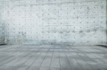 empty brick floor ground with rough textured industrial style concrete wall background.