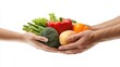 © Kelumlakmal - A close-up view of hands holding fresh organic vegetables harvested
